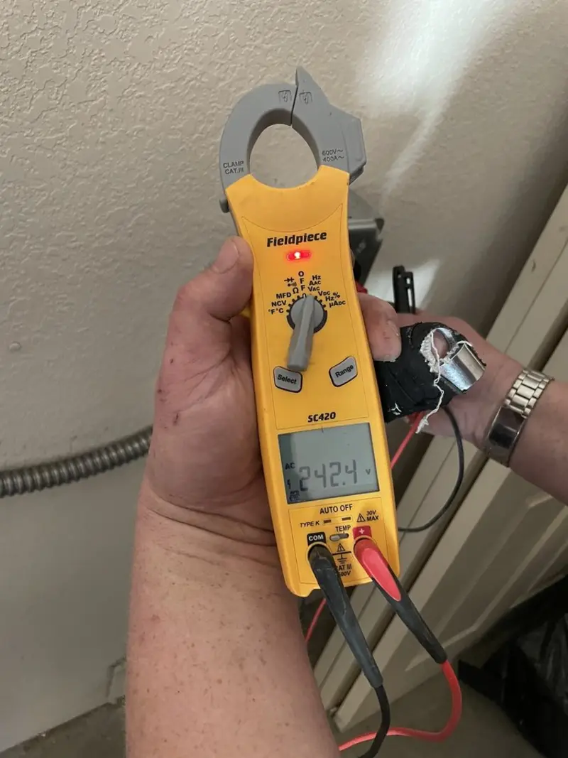Voltage testing with clamp meter during Electrical Installation Services in Kalama